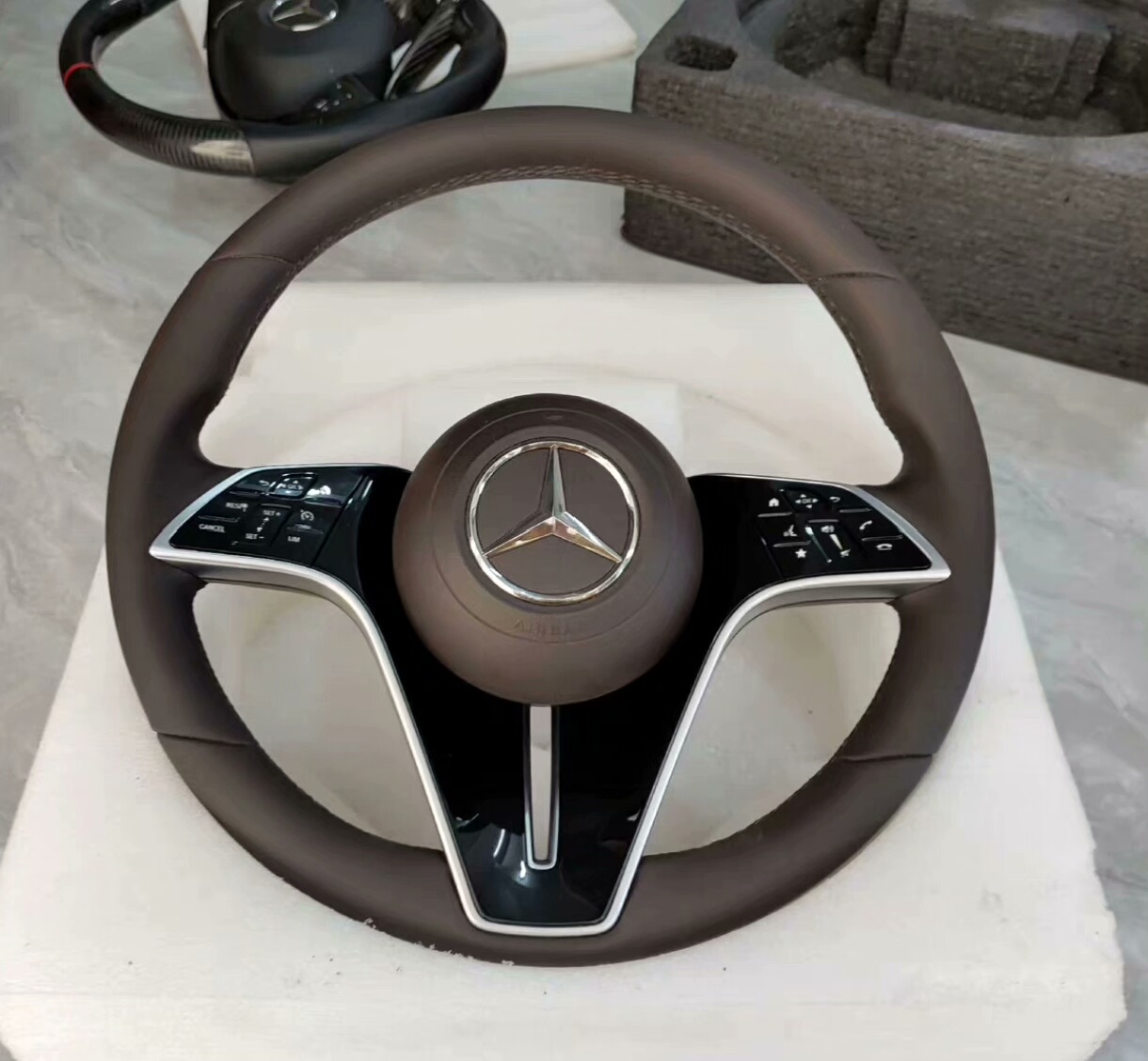 Brand-new Mercedes-Benz butterfly steering wheel Specifically designed for 10th to 24th generation Mercedes-Benz E-Class models, including the E200 and E300L upgrades.