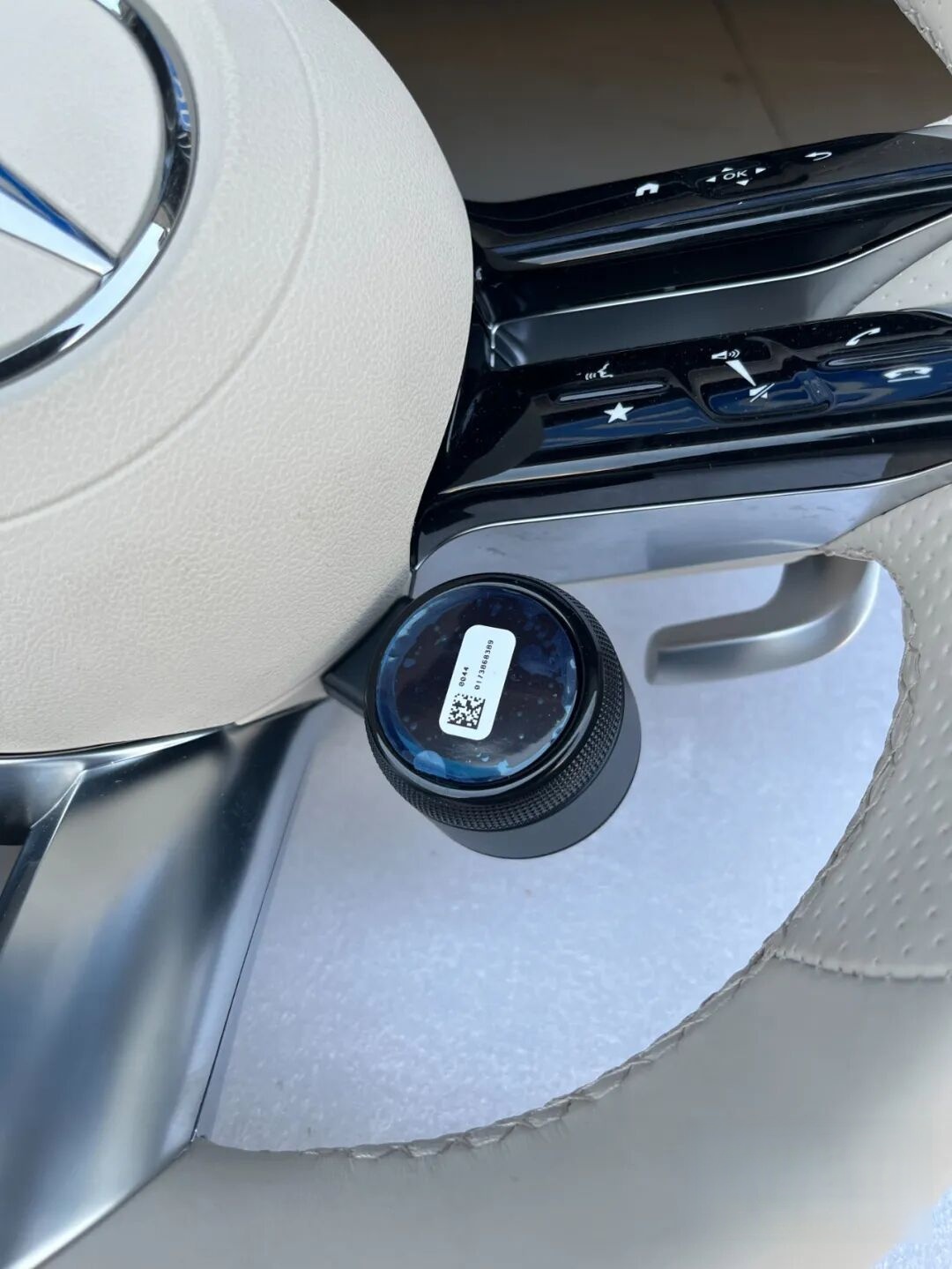 Beige AMG steering wheel close-up