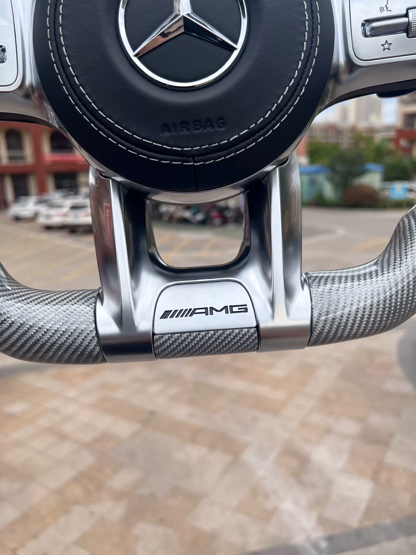 Mercedes-AMG flat-bottom sports steering wheel assembly, silver carbon fiber, genuine perforated leather