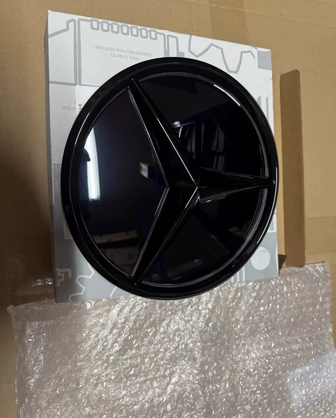Mercedes-Benz G-Class W465 2025 OEM Illuminated Grille Emblem (Smoked Black)