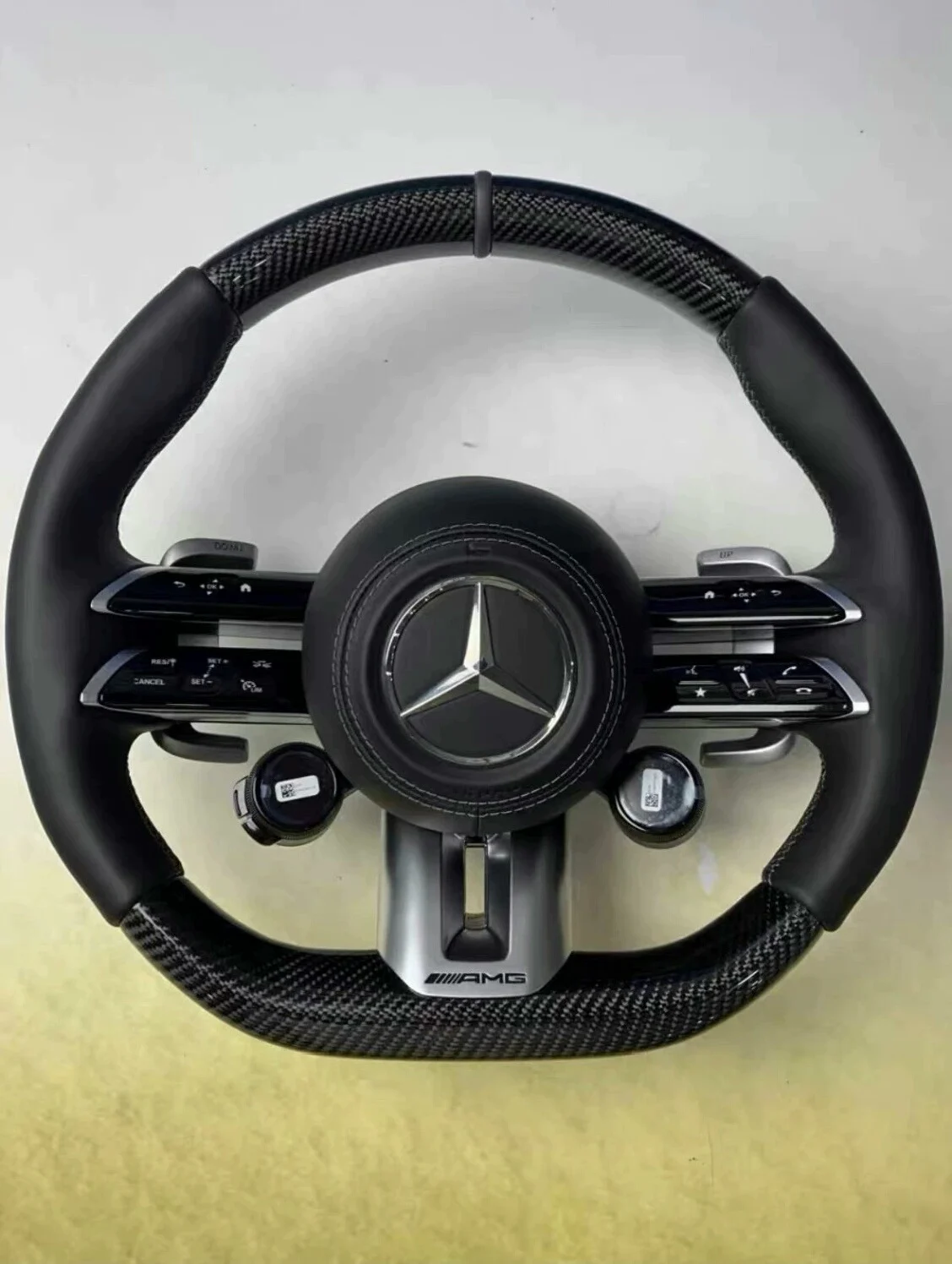 Mercedes-Benz 801 AMG Carbon Fiber Steering Wheel Assembly Supports retrofitting old models with new features. Multi-function buttons + carbon fiber paddle shifters